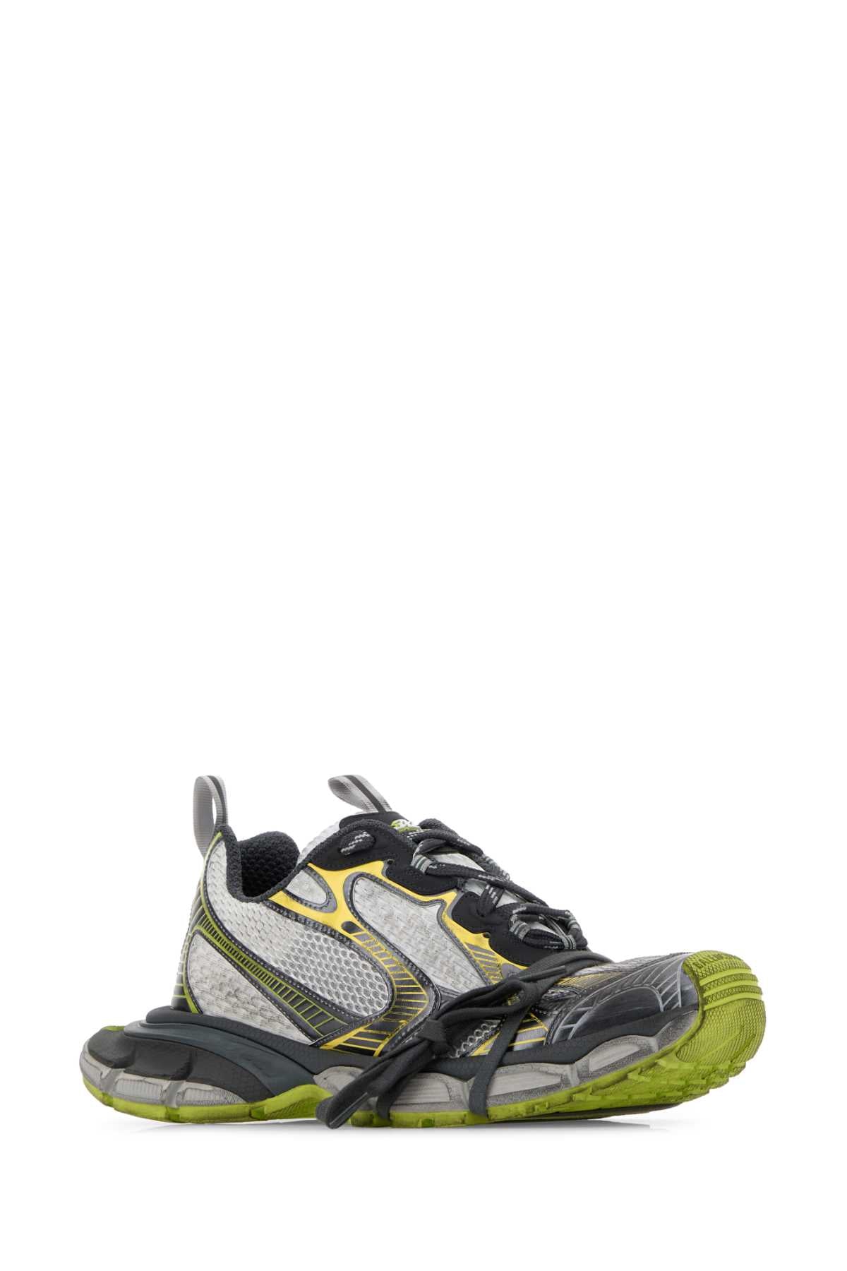 Gray and green athletic shoe on a white background
