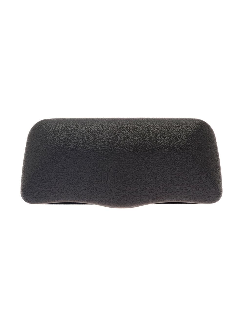 Elevate your style with these authentic Balenciaga sunglasses, featuring a bold black rectangular acetate frame and sophisticated gold-tone hardware. Detailed with a subtle BB logo concealing the hinges, these chic shades offer a perfect blend of modern luxury and timeless design. Includes a black leather glasses case.