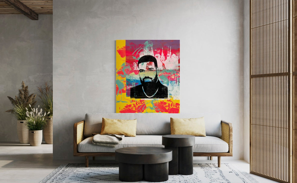 Original contemporary art piece featuring a stylized portrait of Drake, created with silk screen, acrylic, and spray paint on a large 50x40 inch gallery-wrapped canvas by artist Denis OUCH. This vibrant, signed modern illustration serves as a bold statement piece for music-themed interior decor.