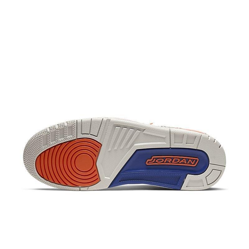 Sole of a Jordan Air Jordan 3 Retro 'Knicks' sneaker with red and blue accents on a white background