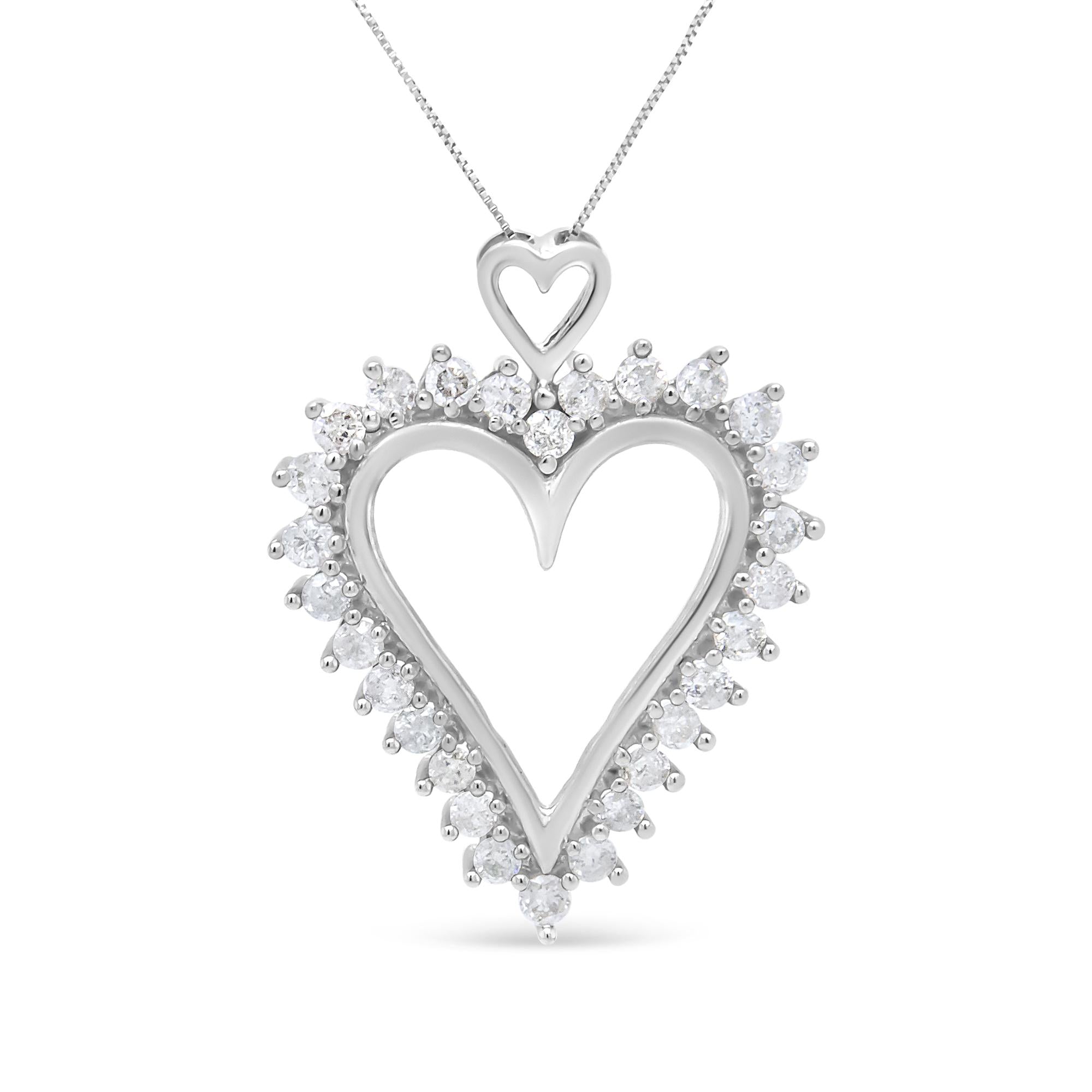 Heart-shaped diamond pendant on a white background