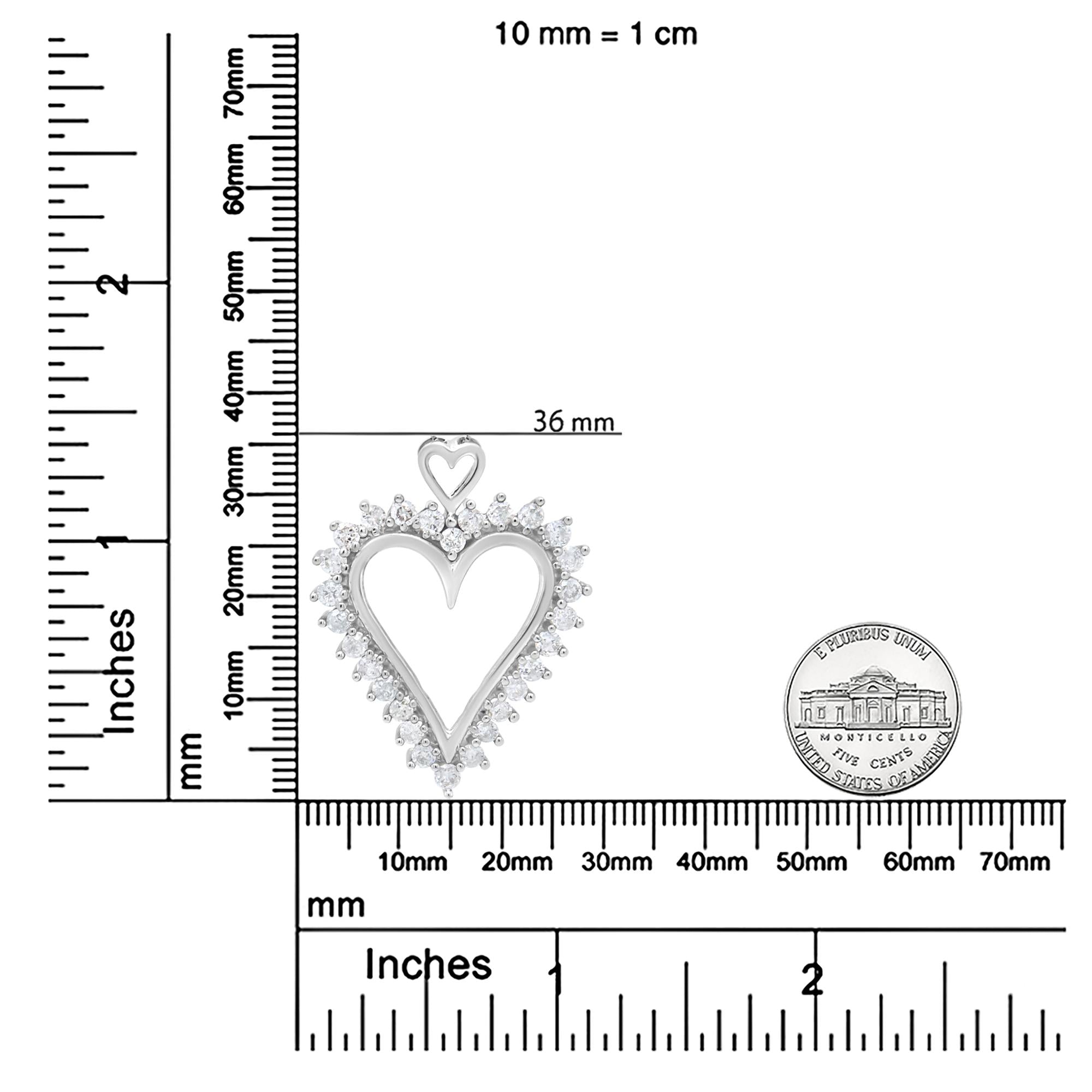 Heart-shaped pendant with measurement scale and Montecarlo Palace logo