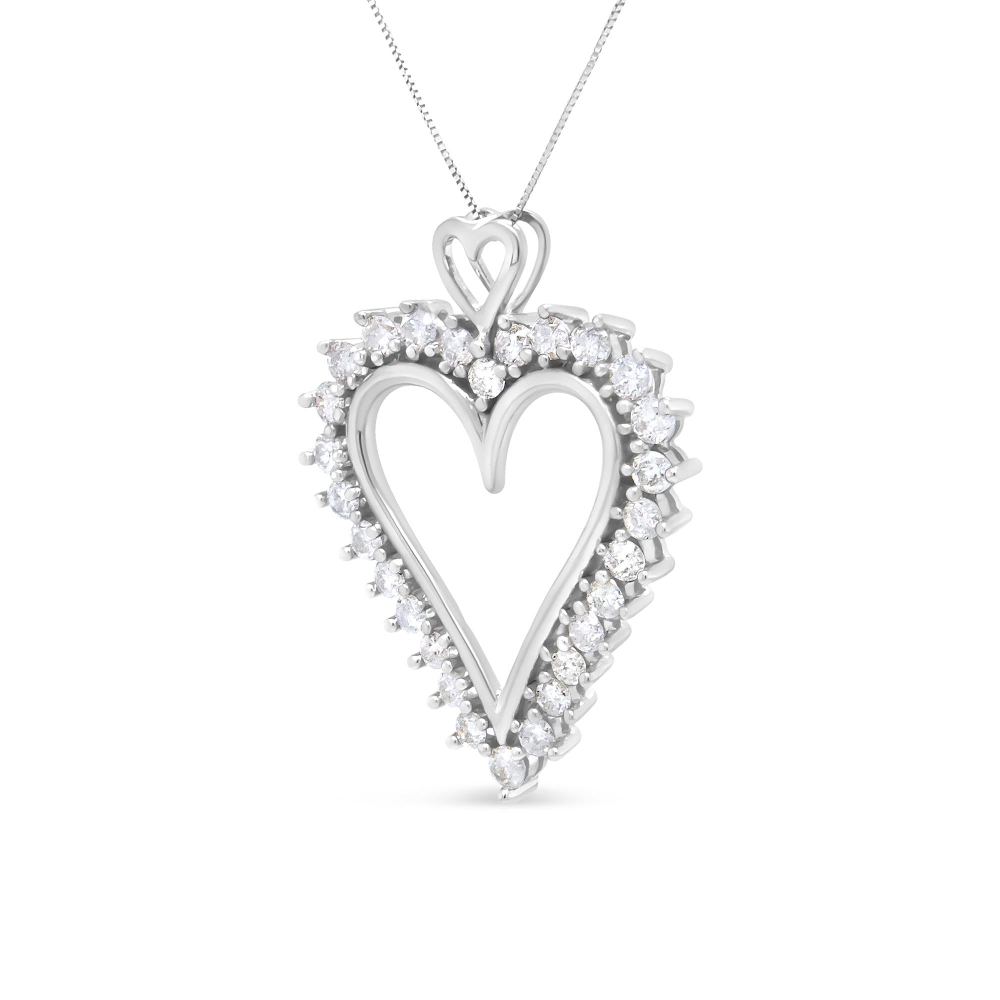 Heart-shaped diamond pendant on a white background