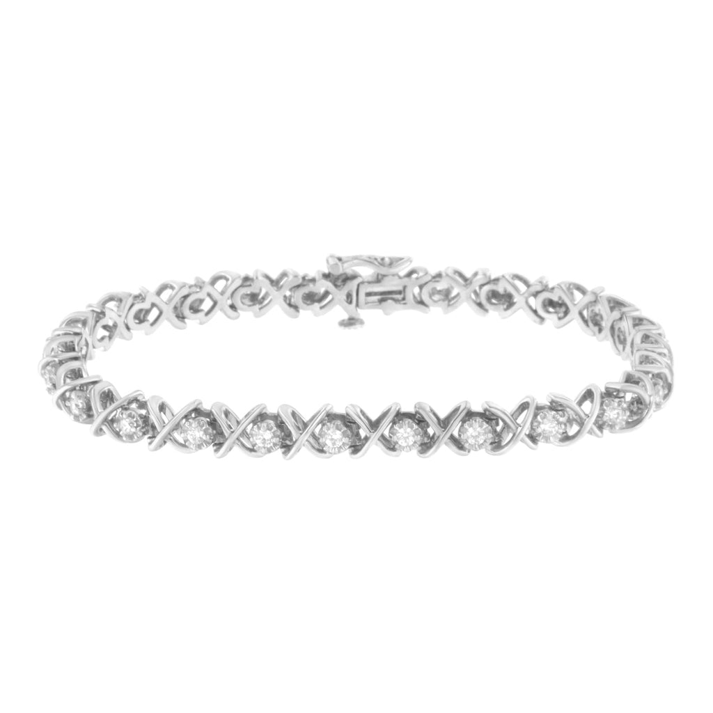 Silver bracelet with clear gemstones on a white background. 1 CTW Natural Diamond X-Link Tennis Bracelet in .925 Sterling Silver – Round-Cut Diamond Luxury Bracelet for Women | 7 Inch Fine Jewelry