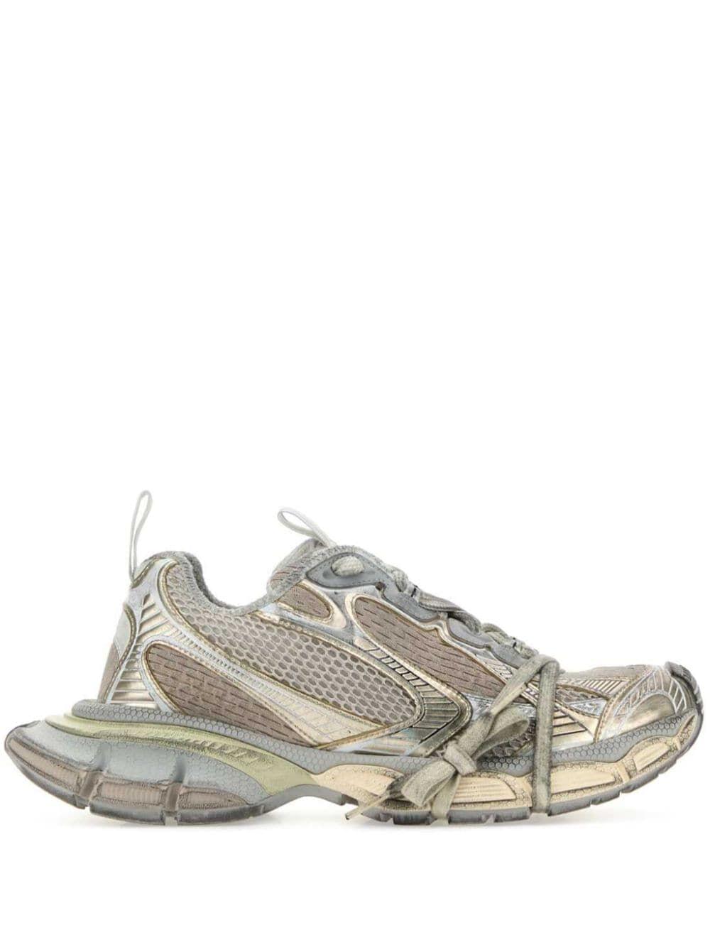Gray and beige athletic shoe on a white background