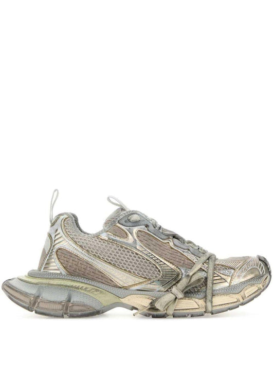 Gray and beige athletic shoe on a white background