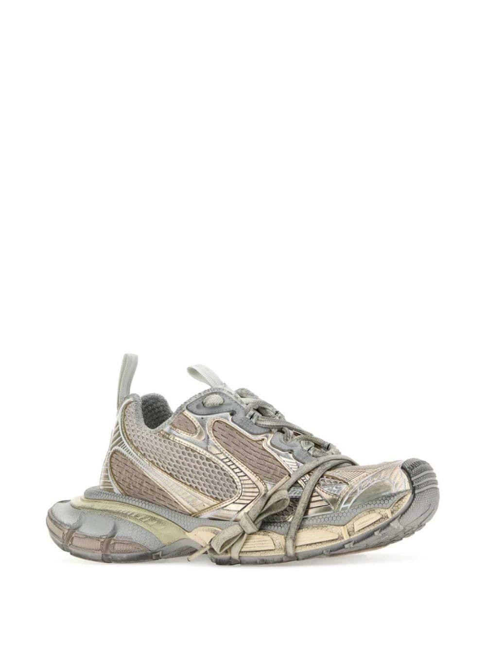 Gray and beige athletic shoe on a white background