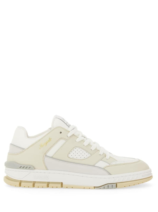 White sneaker with beige sole on a white background