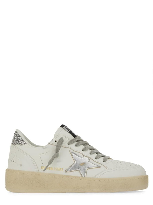 A single Golden Goose Star sneaker in off-white leather with a distressed beige sole, featuring a metallic silver star on the side, grey laces, and gold 'GOLDENBALLSTARS' branding.