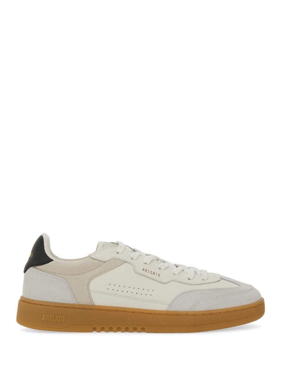 White sneaker with brown sole on a white background