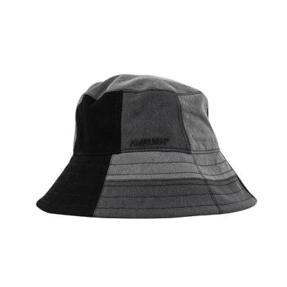 A gray and black patchwork bucket hat with a small black brand label on the front, shown against a plain white background.