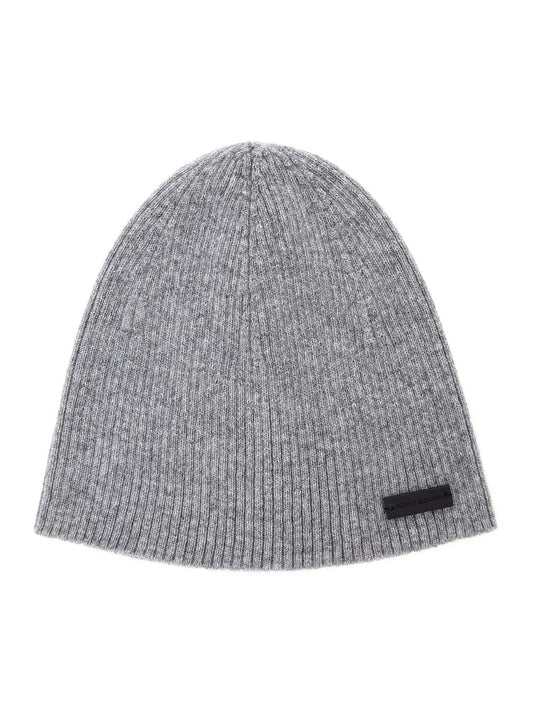 Saint Laurent men's grey cashmere beanie featuring a black logo patch on the front, showcased against a clean white background.