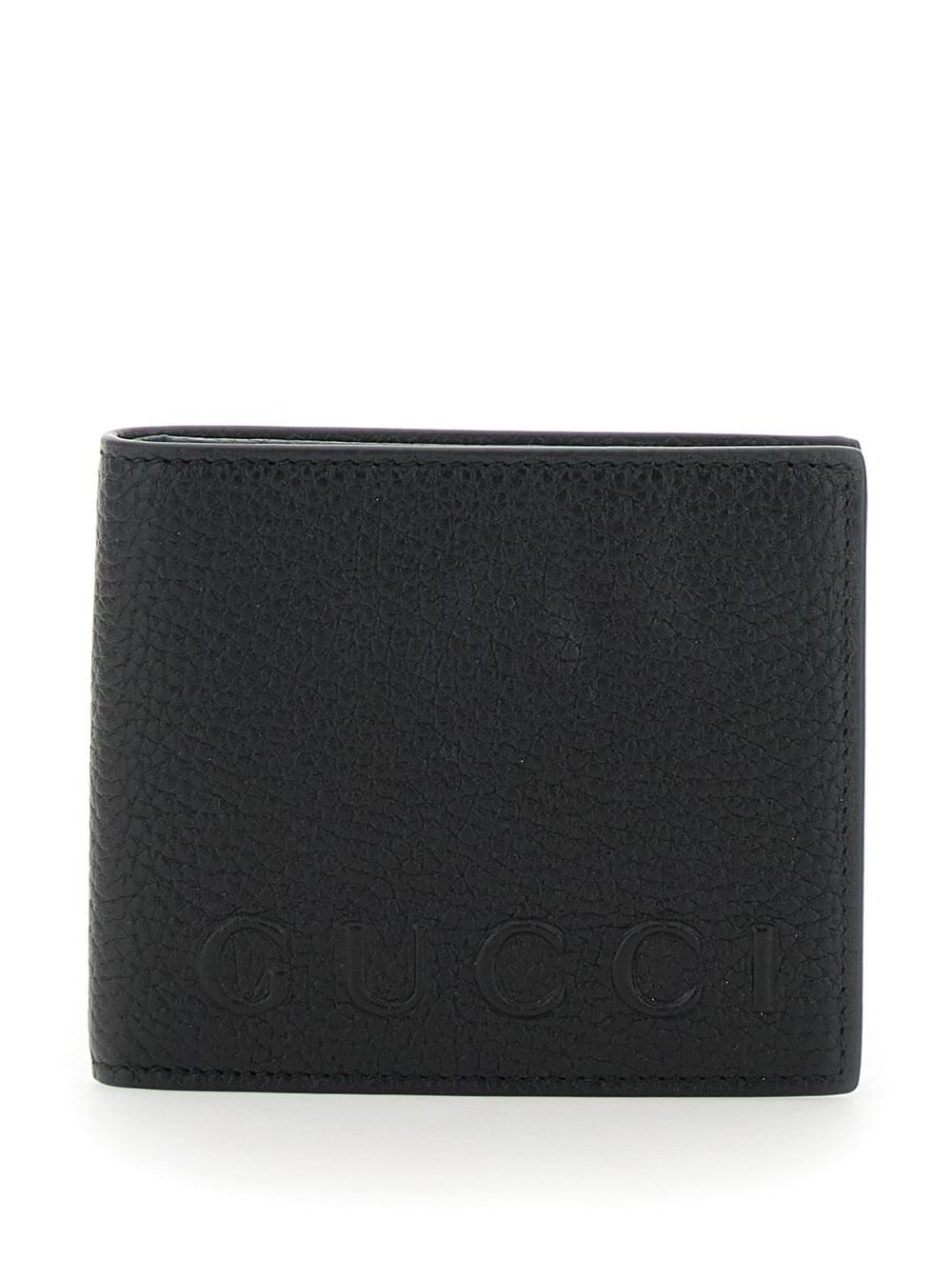 Gucci Men Black Bi-Fold Wallet With Embossed Logo Lettering On The Front In Grained Leather Man