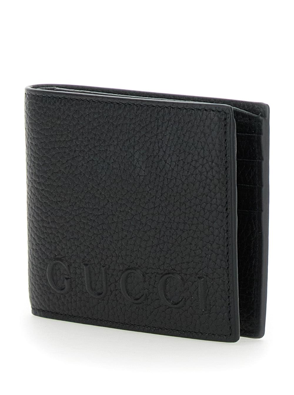 Gucci Men Black Bi-Fold Wallet With Embossed Logo Lettering On The Front In Grained Leather Man