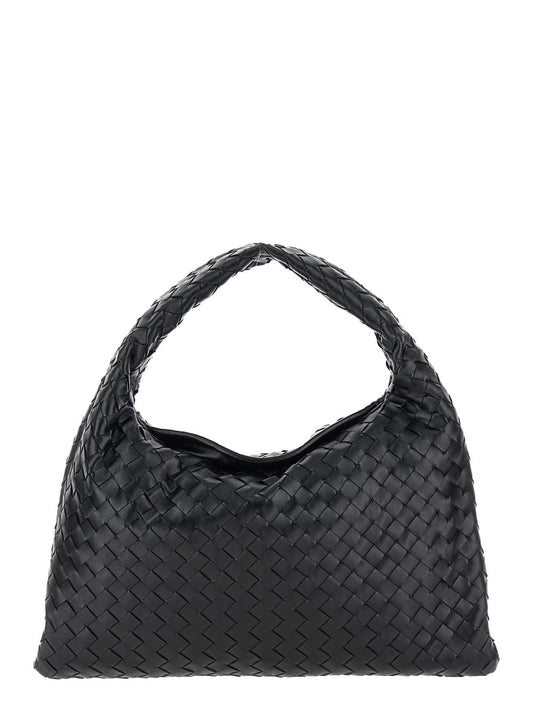 Bottega Veneta Hop Piccola shoulder bag in black leather featuring the signature intreccio woven motif, captured against a clean white background.
