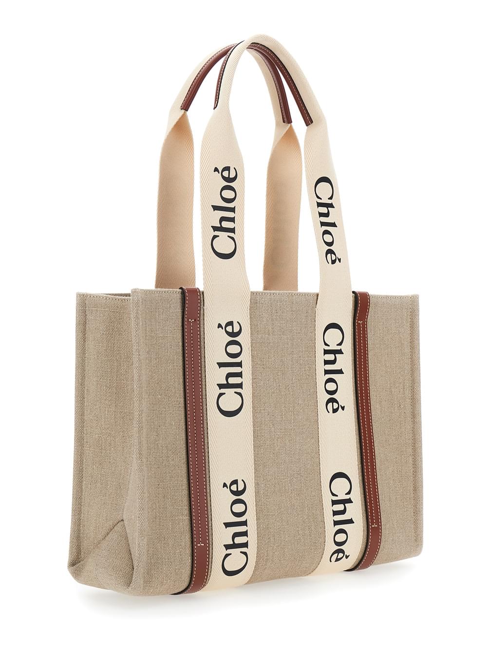 Chloé Woody Medium tote bag in beige linen featuring iconic logo lettering on the front.
