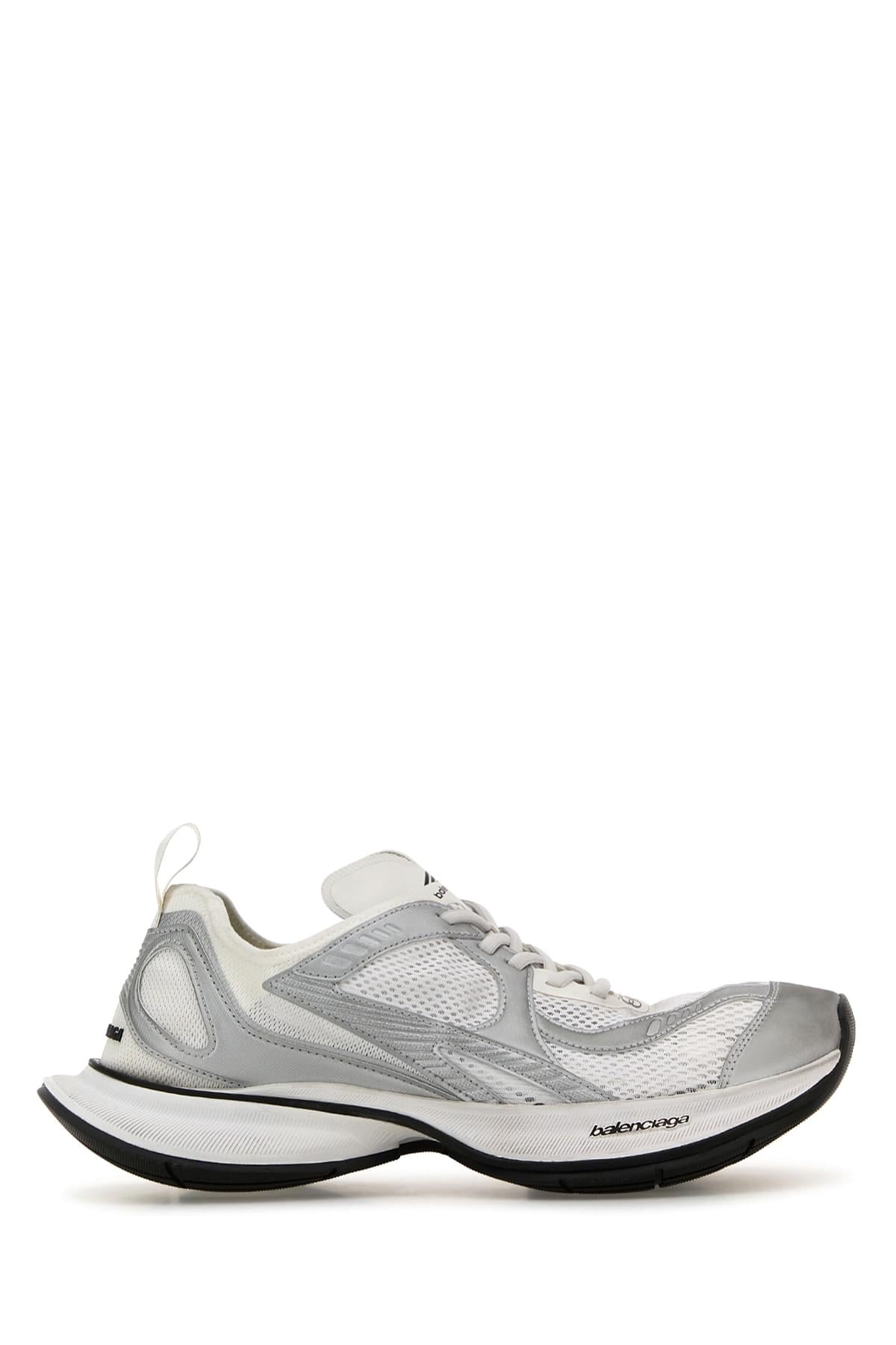 Gray sneaker with black sole on a white background