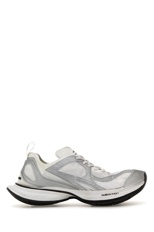 Gray sneaker with black sole on a white background
