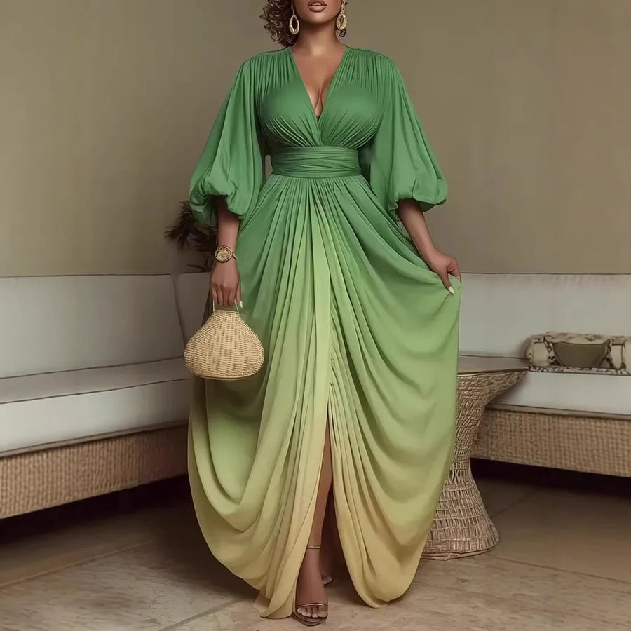 Woman wearing a green flowing dress in an indoor setting