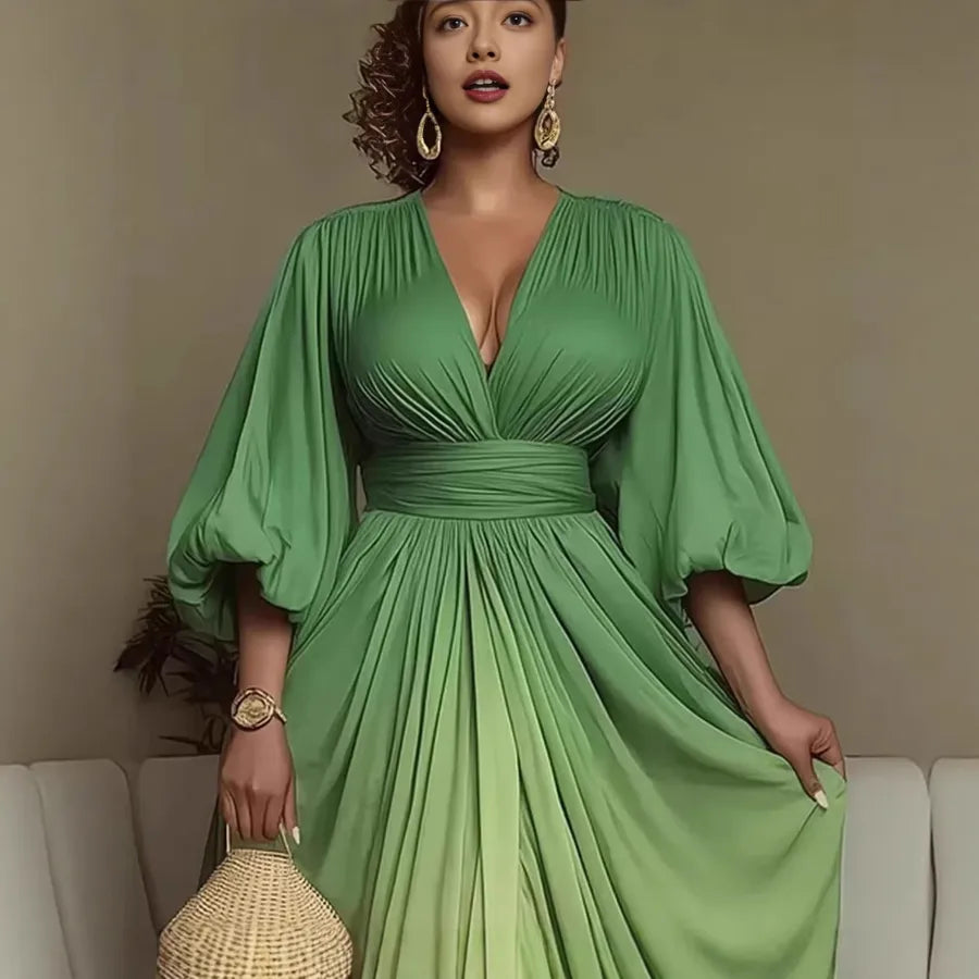 Woman wearing a green dress with puffed sleeves against a neutral background