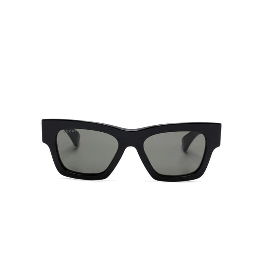 Black Gucci sunglasses with a white background
