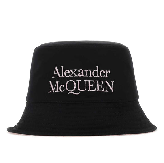 Black bucket hat with 'Alexander McQueen' logo on a white background