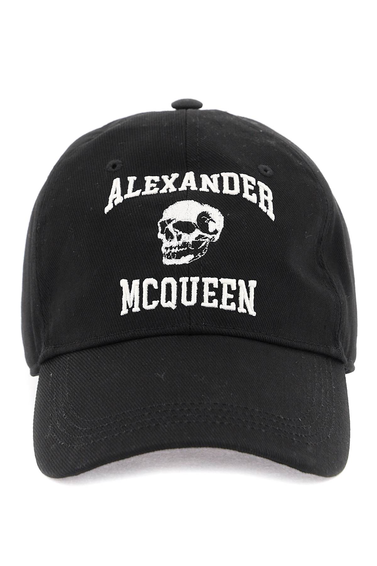 A black cotton baseball cap featuring white embroidered text reading 'ALEXANDER MCQUEEN' and a white skull graphic on the front, photographed against a plain white background.
