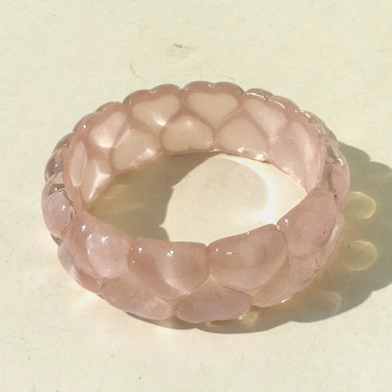 Pink stone ring on a beige background