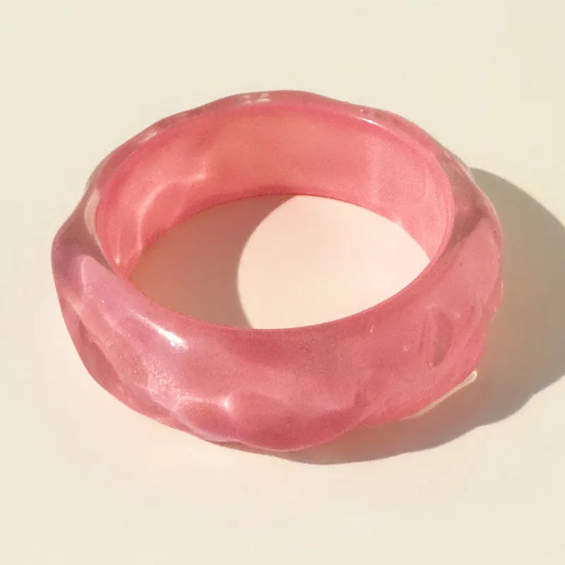 Pink bangle on a beige background