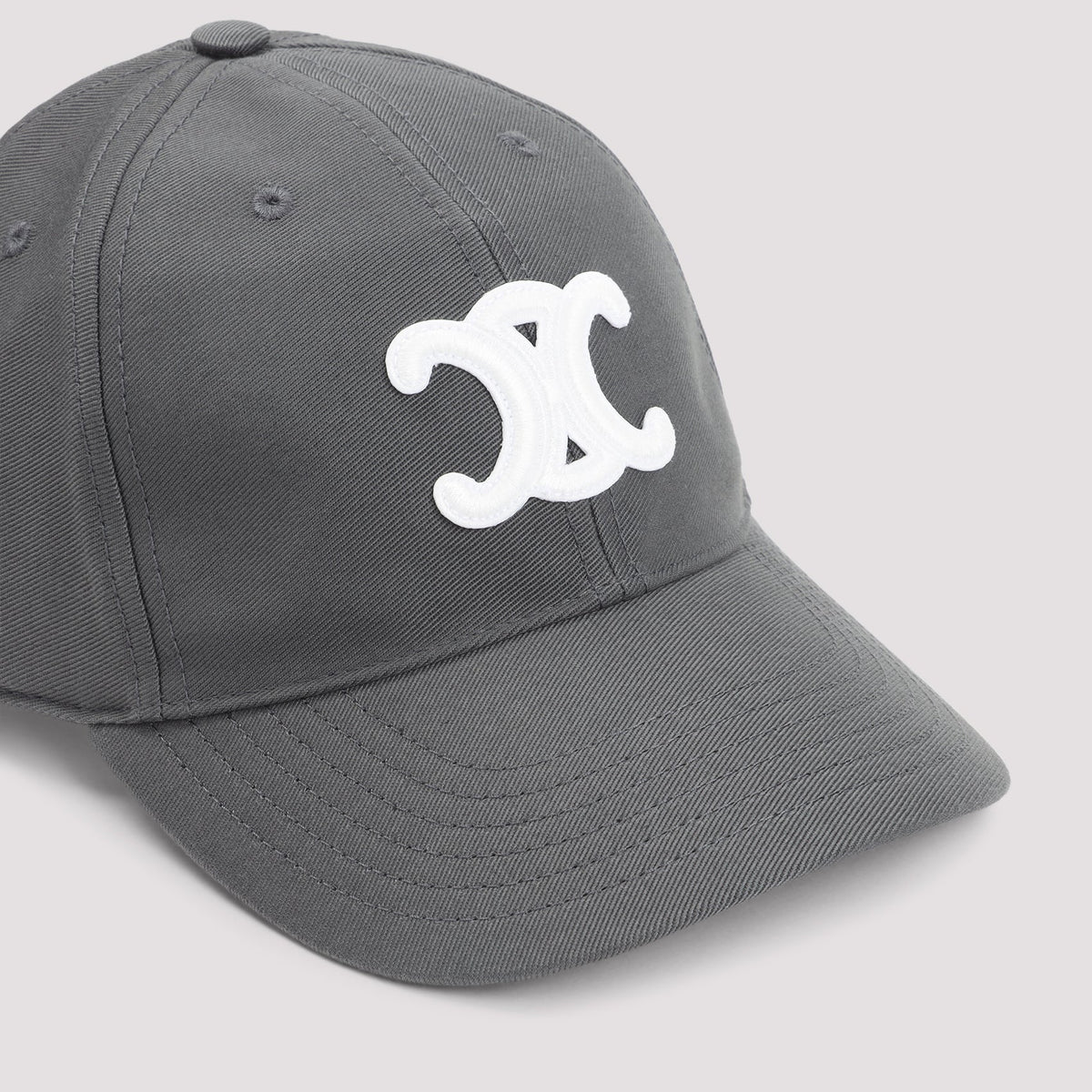 Gray cap with a white logo on a light gray background