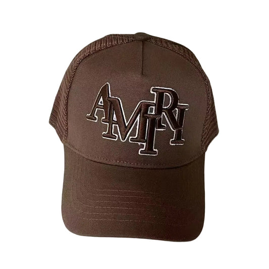 Brown cap with 'AMIRI' logo on a white background