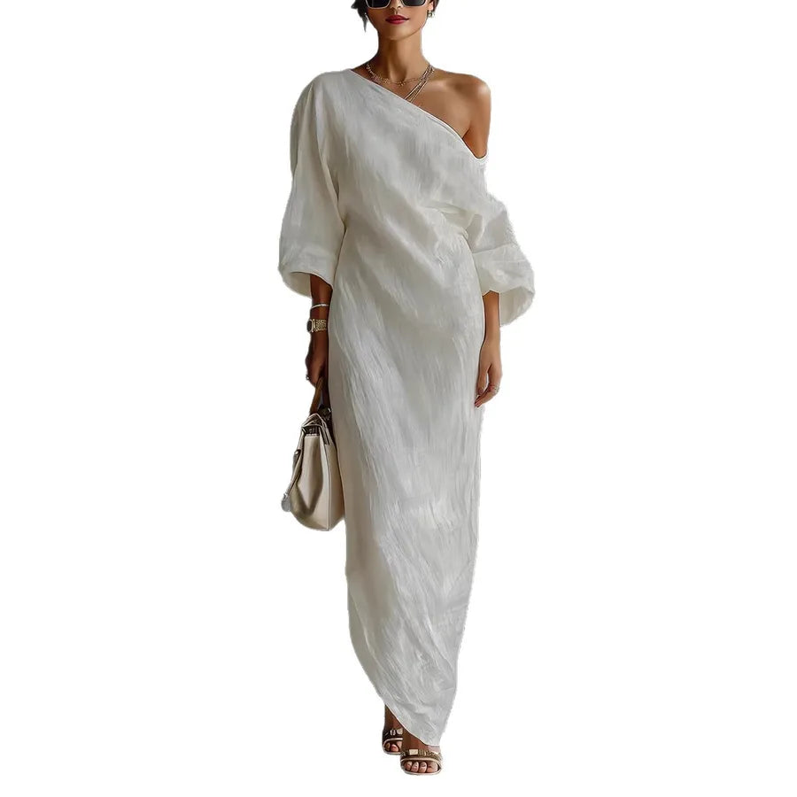 Woman wearing a white one-shoulder dress on a white background