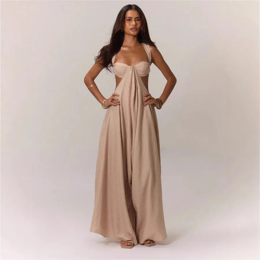 Woman wearing a beige strapless gown on a plain background