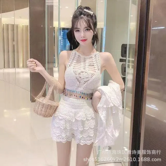 Woman in a white lace dress holding a basket in an indoor setting