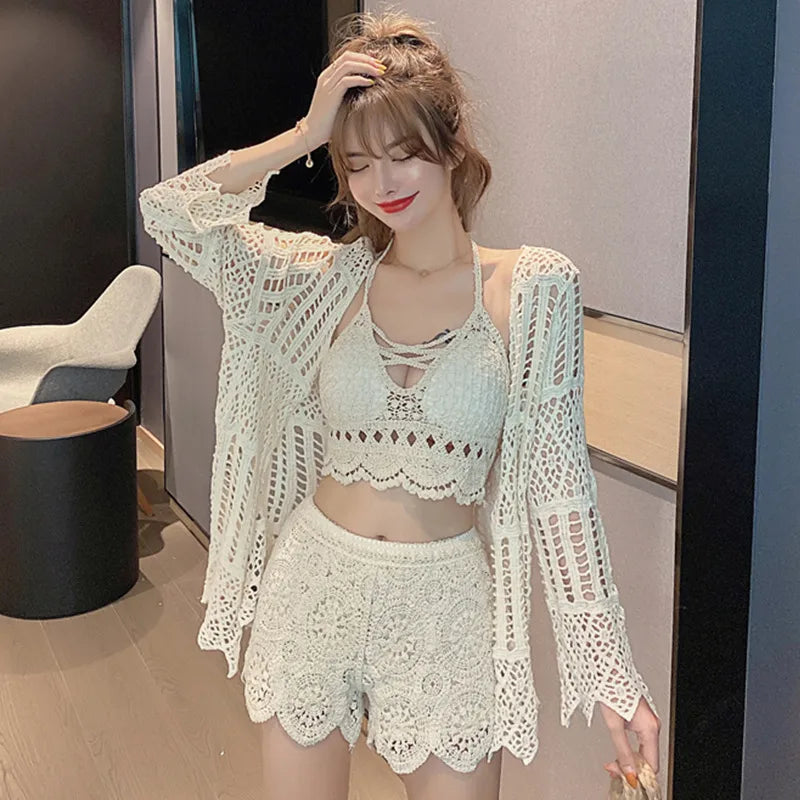 Woman wearing a light green crochet outfit in an indoor setting