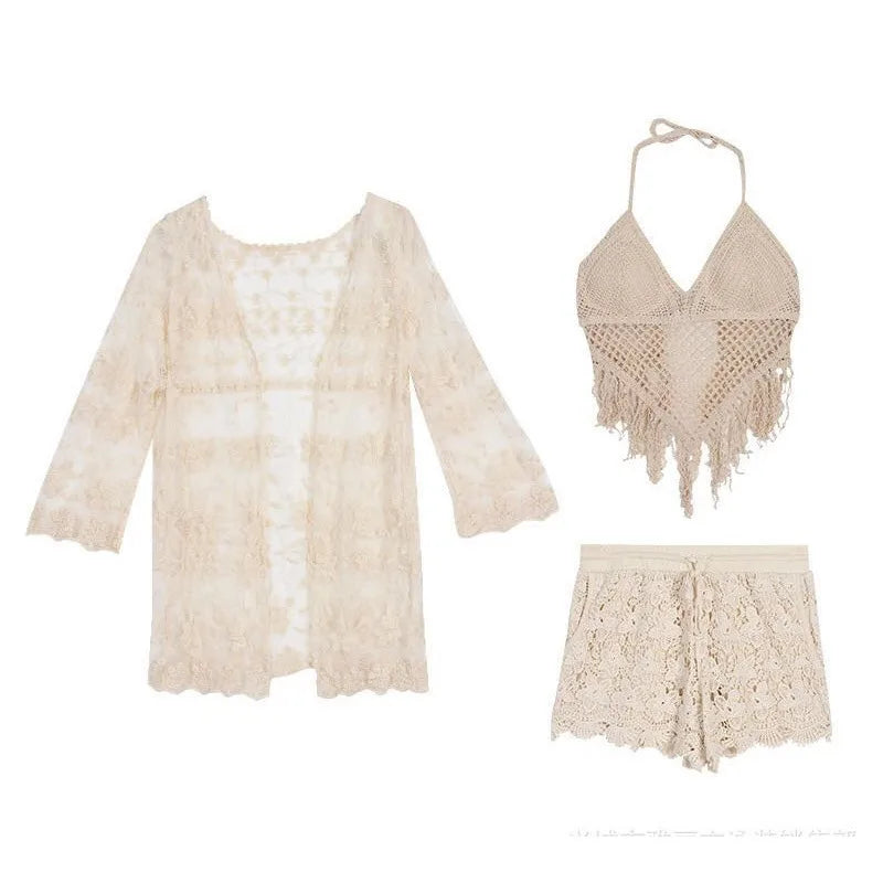 Beige lace outfit with top, cardigan, and shorts on a white background