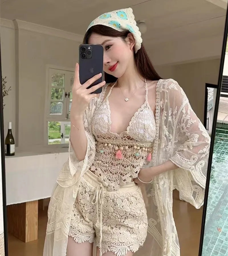 Woman taking a mirror selfie wearing a lace outfit indoors.