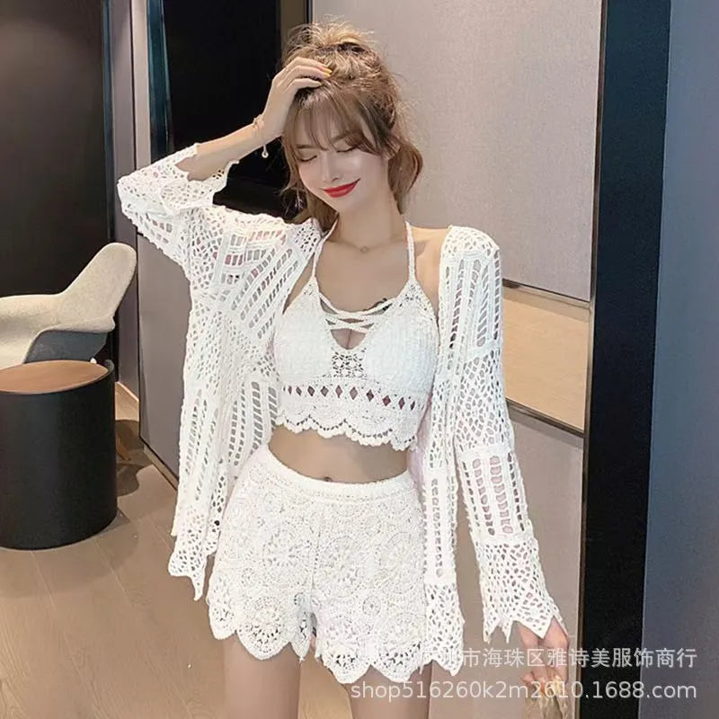Woman wearing a white lace outfit in an indoor setting
