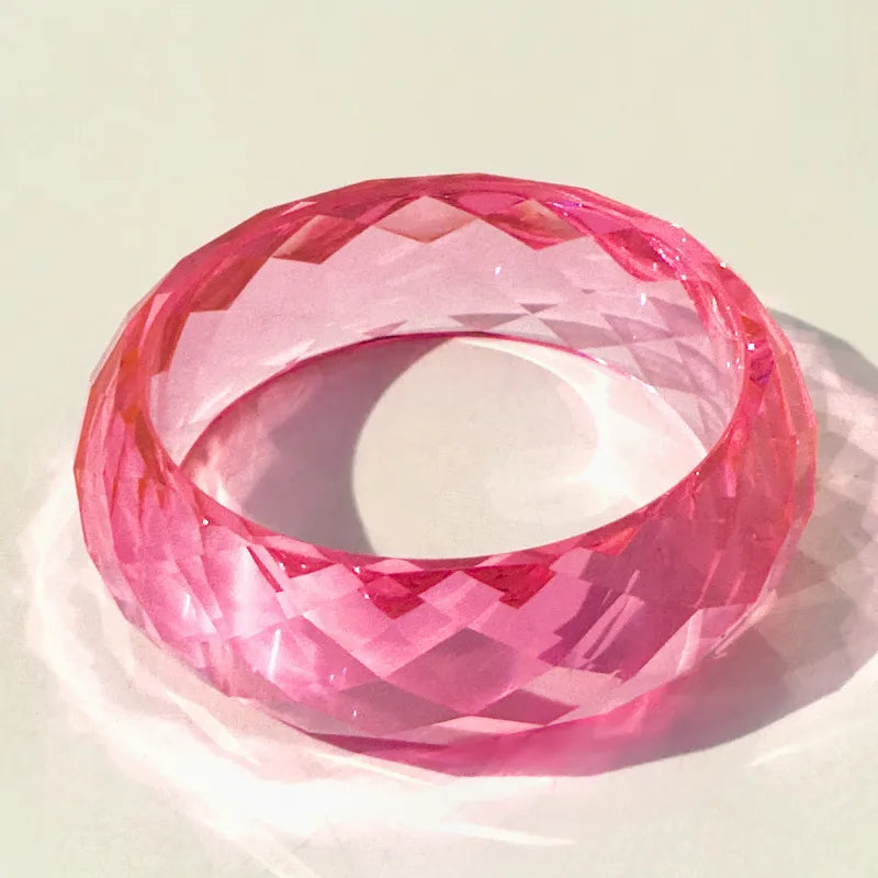 Pink bangle on a light beige background