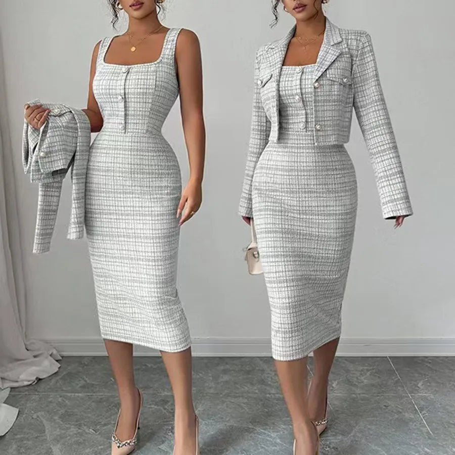 Woman wearing a checkered dress and jacket set on a gray background