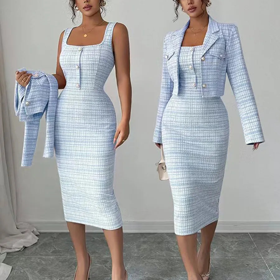 Woman wearing a light blue checkered dress and matching jacket on a plain background