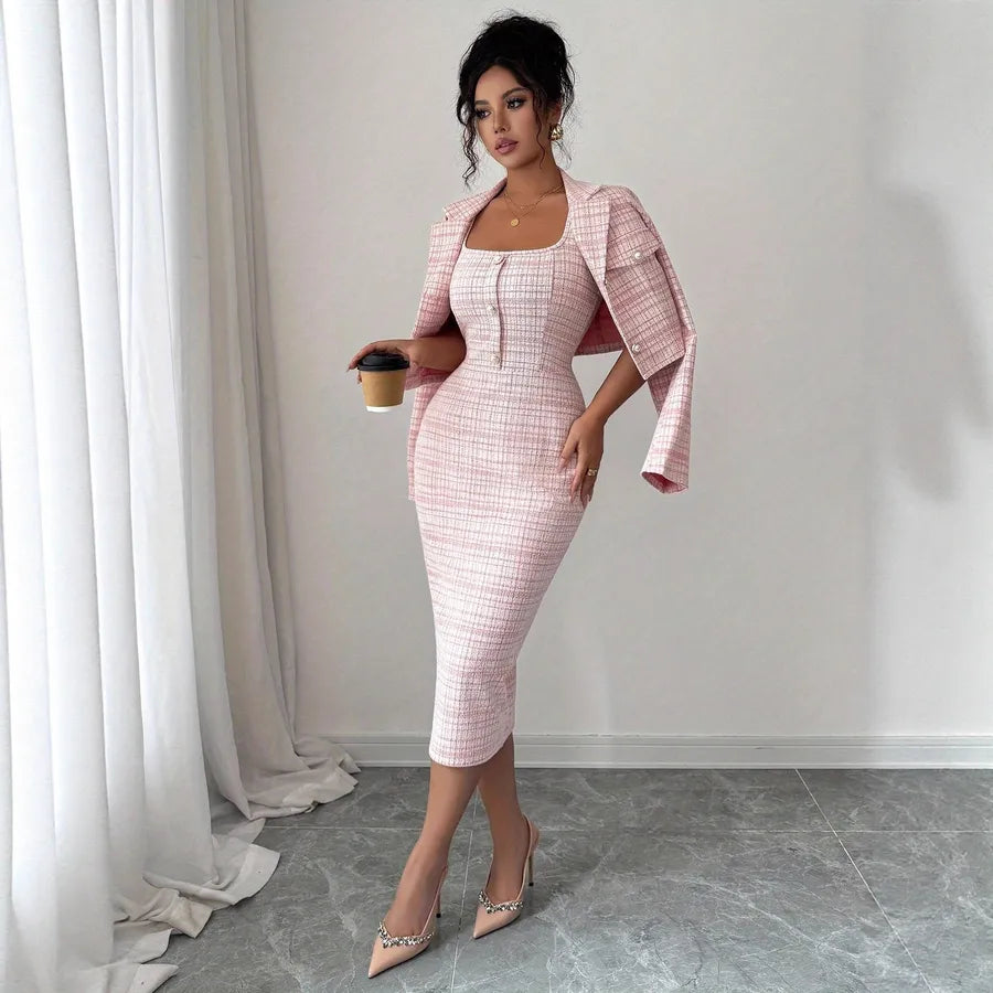 Woman in a pink checkered outfit holding a coffee cup in a room with white curtains.