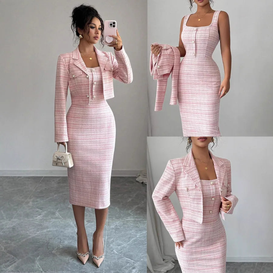Pink checkered suit with jacket and skirt worn by a model against a neutral background.