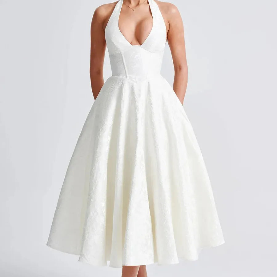 White halter-neck dress on a plain background