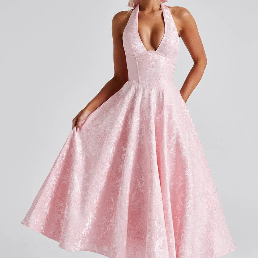 Pink evening gown on a plain background
