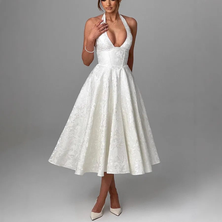 White lace dress on a model against a gray background
