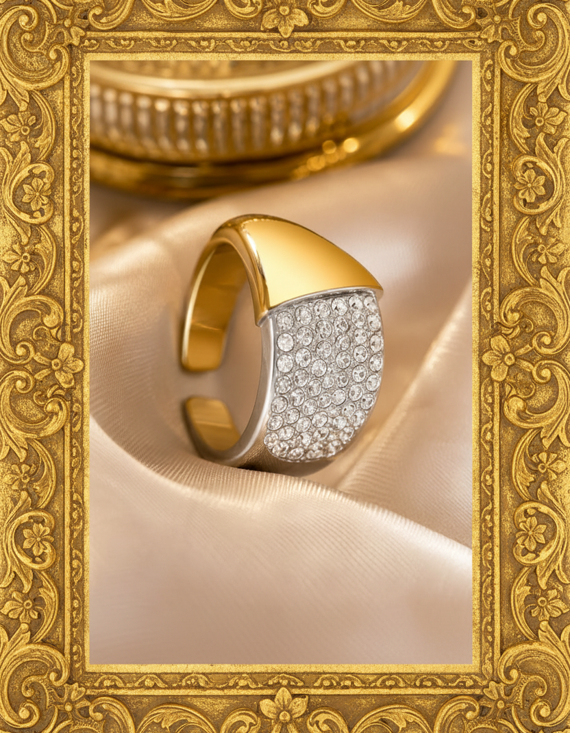 Gold and silver bracelet with diamond accents on a beige fabric background Luxury 18K Gold PVD Plated Geometric Zircon Ring – Adjustable Stainless Steel Statement Band for Women & Men