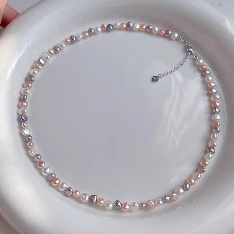 Pearl necklace on a white plate
