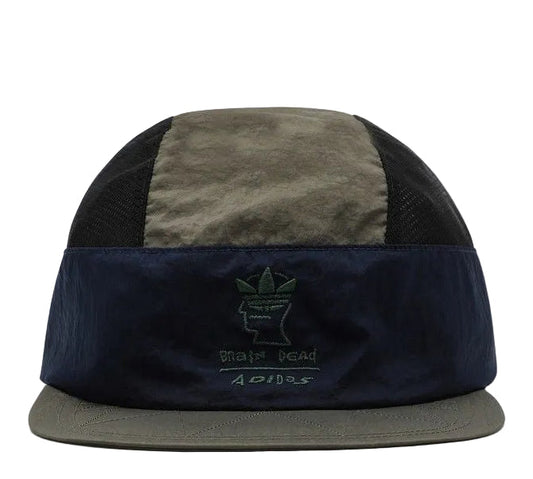 Two-tone cap with black and green sections on a white background