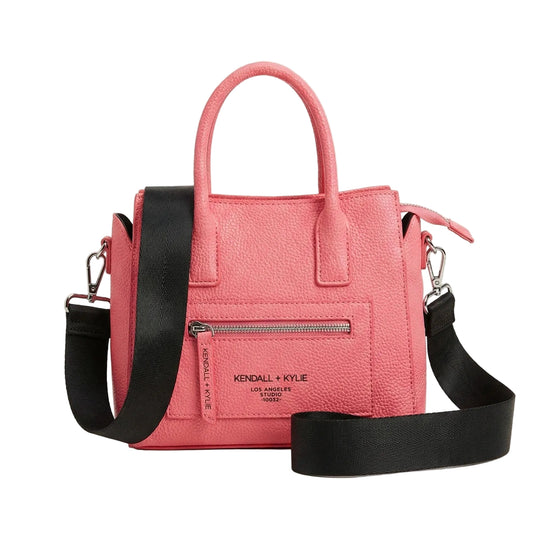 Pink handbag with a black strap on a light gray background